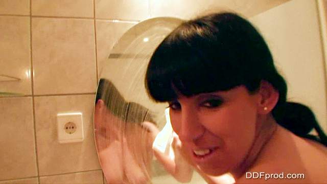 Brunette Lisa Sparkle gives a hot handjob in the bathroom