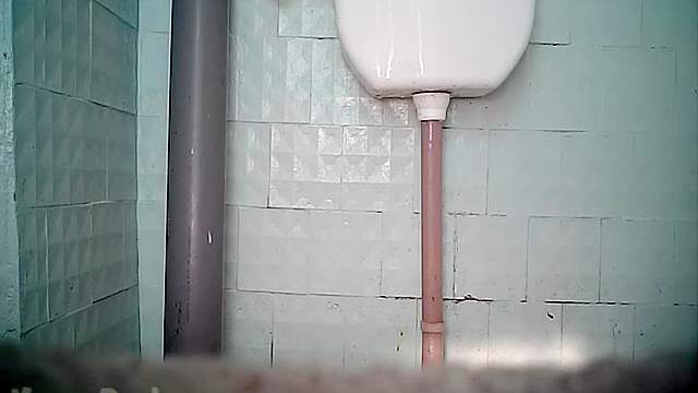 Cute beauty is pissing in the voyeur scene