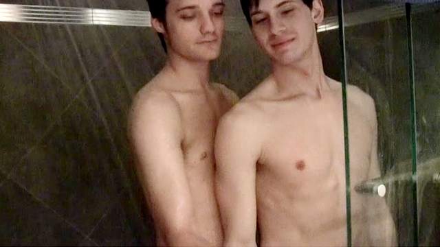 Gay brunette is fucking his friend in the shower