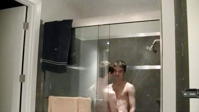 Gay brunette is fucking his friend in the shower