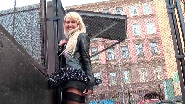 Leggy blonde demonstrates outdoors her stockings