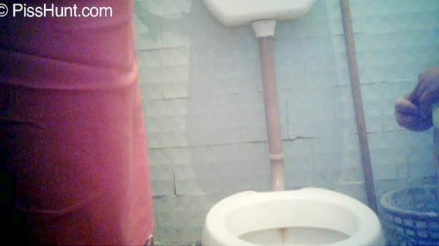 Horny as fuck babe is pissing in the toilet