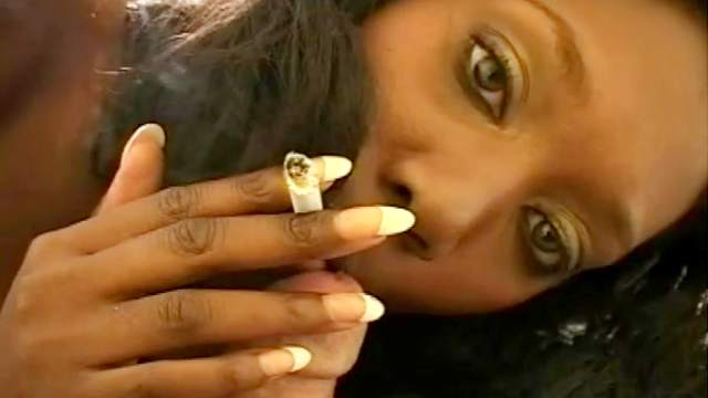 Ebony is sucking a dick and smoking