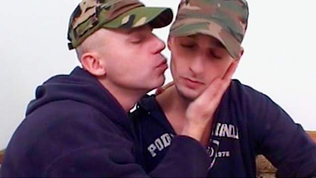 Two soldiers are sucking dicks with smiles