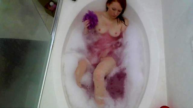 Solo masturbation in the bathroom with a redhead