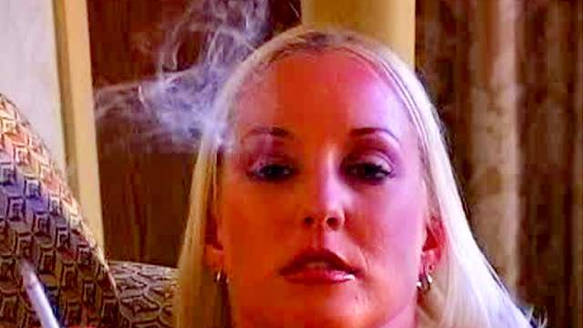 Alluring mature pokes her vagina with cigarette