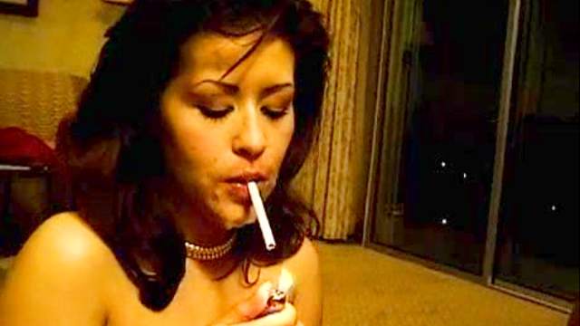 Sexy brunette is smoking and sucking