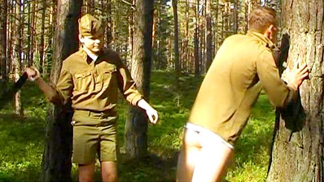 Sexy soldiers are spanking each other in the forest