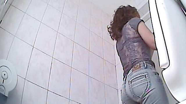 Slender babe is captured pissing on voyeur camera