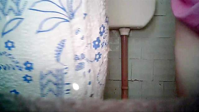 Mature BBW caught pissing in the toilet