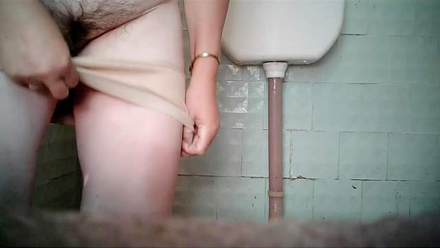 Mature BBW caught pissing in the toilet