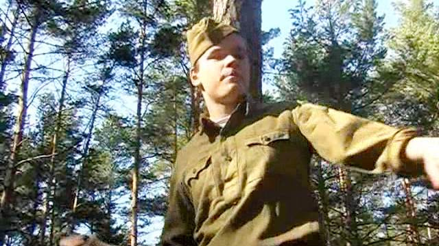 Outdoor spanking scene with two soldiers