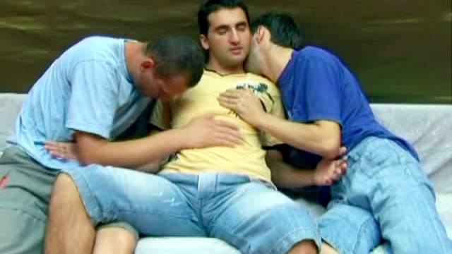 Dark-haired gays in jeans have anal in threesome