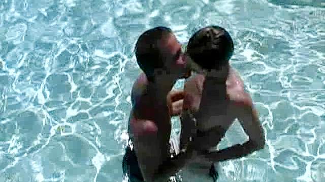 Two gays kiss each other and get naughty in the pool