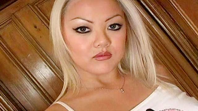 Asian blonde shows her small tits