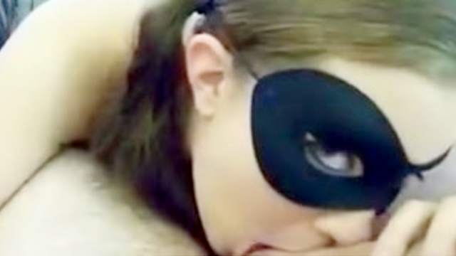 Brunette teen wearing a mask sucks this guys ball and dick