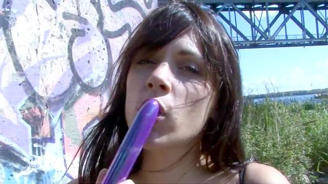 Brown-haired pregnant gal bangs her snatch with a purple toy