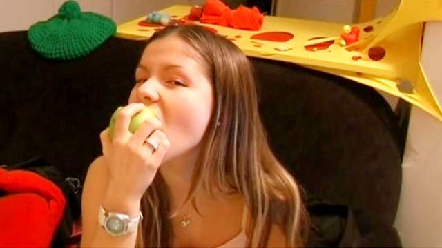 Cute teen wearing pink panties eat an apple