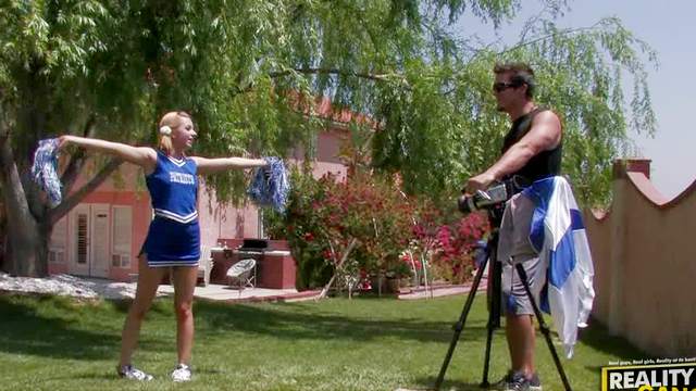 Stuffing a cheerleader in the university yard