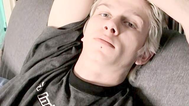 Teen blonde boyfriend jerks his dick on the sofa