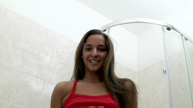 Teen with small tanned tits is taking a shower