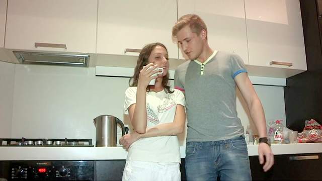 Cute skinny brunette is fucking in the kitchen