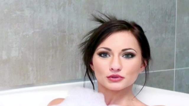 Isizzu is lying naked in soapy bath