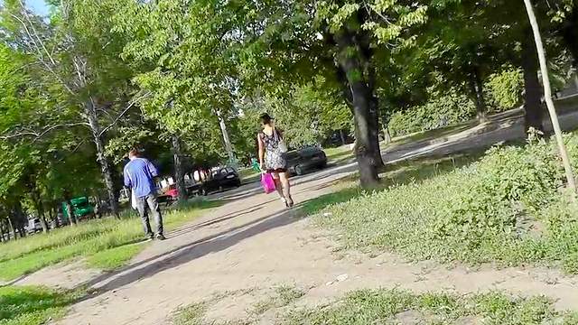 Outdoor scene with a young girl in sexy dress