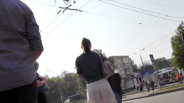 Sexy upskirt on the street with leggy brunette