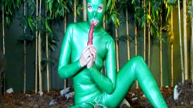 Babe Camila poses in hot green latex