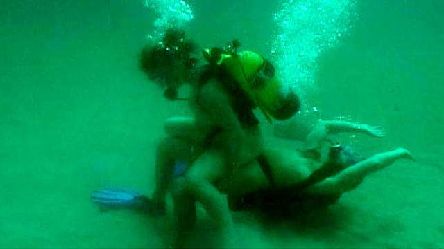 Busty girl having underwater sex with her man