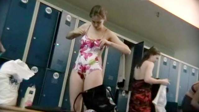 Sexy babe is getting naked in the locker room