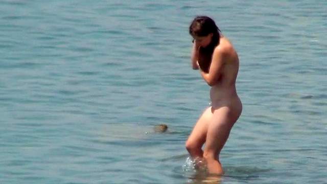 Hot nudists are posing on the beach