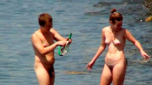 Cuties are posing totally naked on the beach