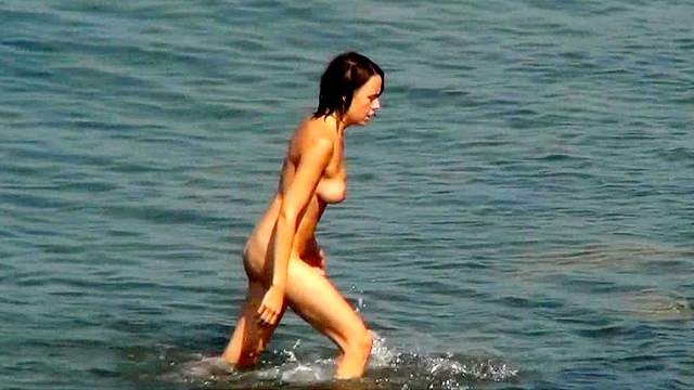 Sexy couple is walking naked at the beach