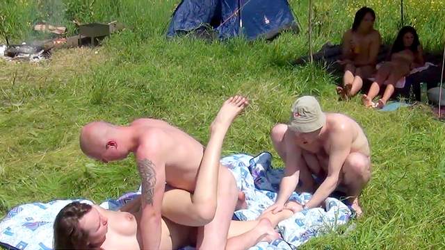 Sexy nudists are fucking outdoors on the grass