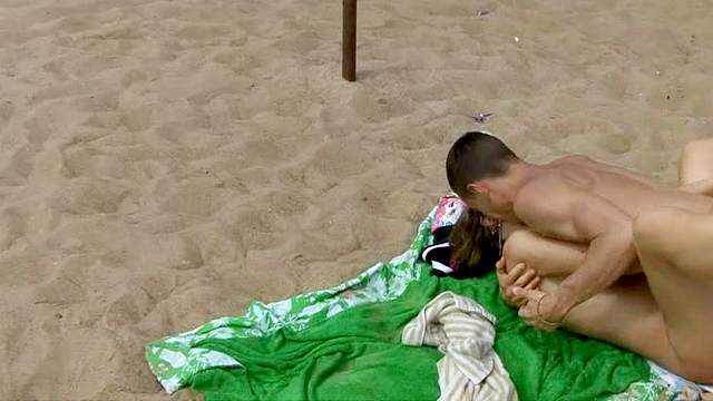 Sexy couple is fucking on the sand