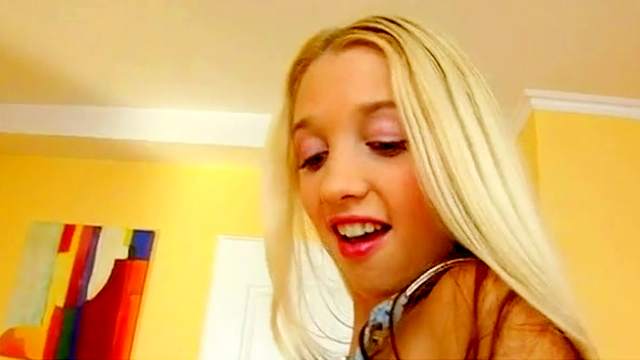 Sexy long-haired blonde is sucking a pole