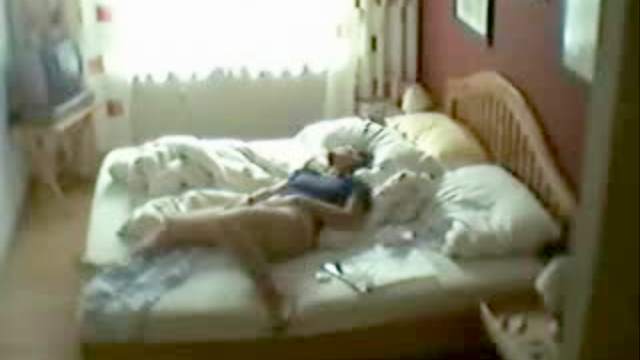 Masturbating babe at home in bed