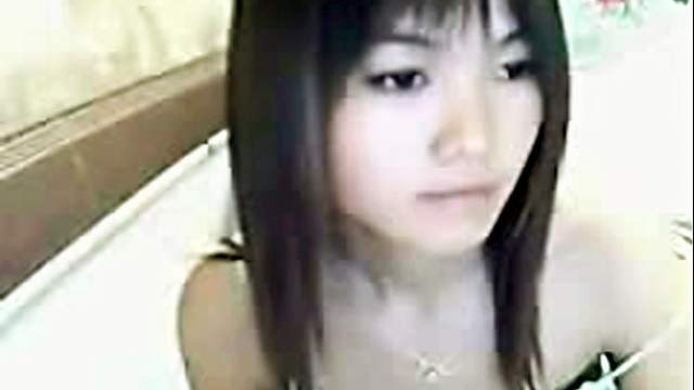 Adorable Asian teen on webcam