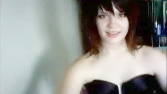 Webcam cutie flashes her titties