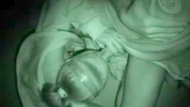 Cute blonde gives night vision blowjob