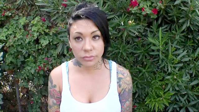 Tattooed blowjob girl outdoors