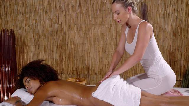 Serious action on the massage table for two lesbian babes