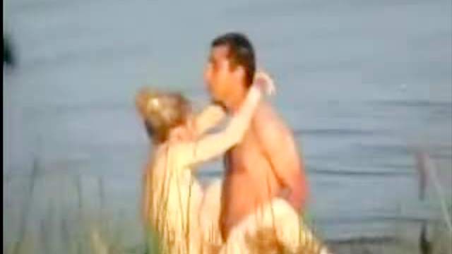 Voyeur porn of couple fucking in lake