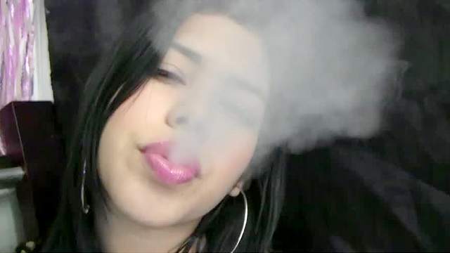 Smoking with her plump lips