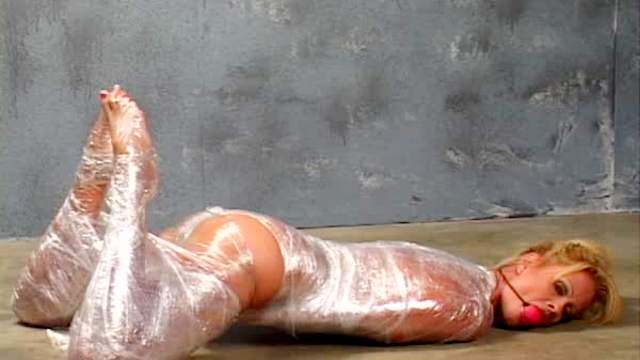 Plastic wrap bondage with cute blonde