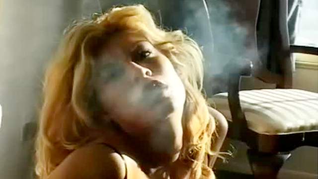 Pornstar smokes in a sexy way