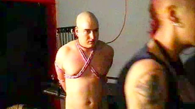 Dominatrix with mohawk abuses him