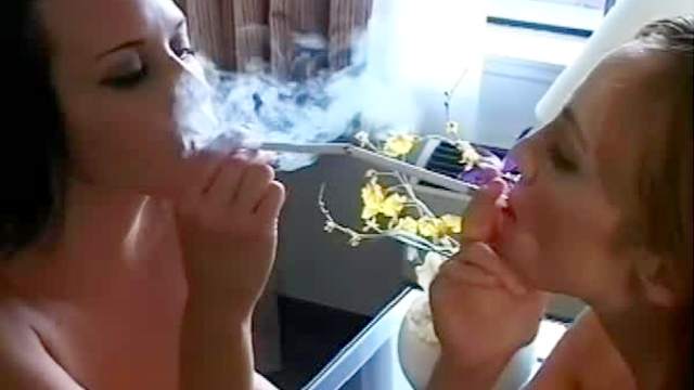 Two beautiful women make smoking porn